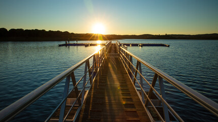 Fototapeta premium bridge on ocean at sunset