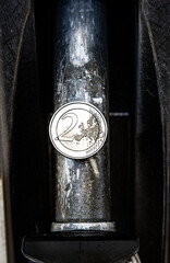 a petrol pistol with a 2 euro coin