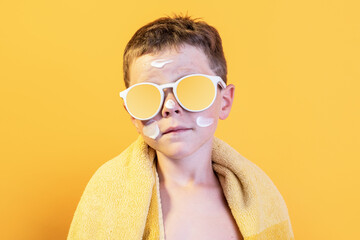 Portrait of cheerful little boy wearing sunglasses