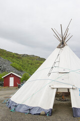 Tipi tent exterior in Norway, with a bonfire