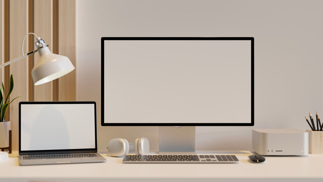 Modern office desk workspace with PC computer and notebook laptop mockup over white wall.