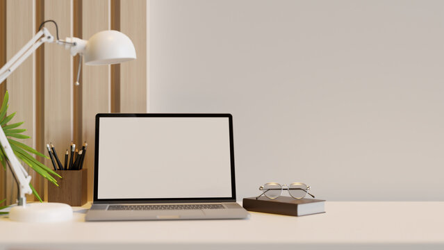 Minimal white and wood workspace interior design with notebook laptop and accessories