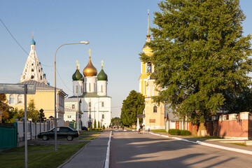 Lazareva street and view of churches and cathedral on Sobornaya square in Kolomna Kremlin in Old Kolomna city on summer evening