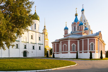 Assumption Cathedral and Church of the Icon of the Mother of God of Tikhvin on Cathedral (Sobornaya) Square of Kolomna Kremlin in Old Kolomna city at summer sunset