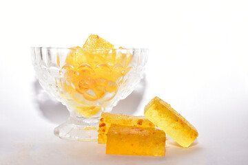 Handmade marmalade with citruses on a white background, isolated. Crystal vase with marmalade.