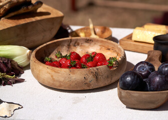 Fresh fruits displayed in wooden bowls