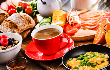 Breakfast served with coffee, scrambled eggs, cereals and ham
