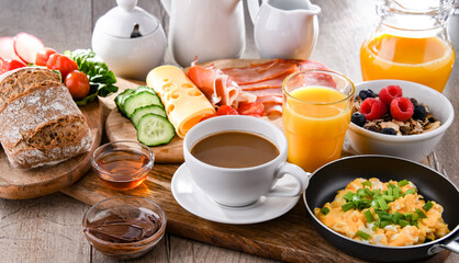 Breakfast served with coffee, scrambled eggs, cereals and ham
