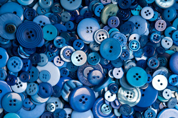 background pattern of blue buttons of various size - obrazy, fototapety, plakaty