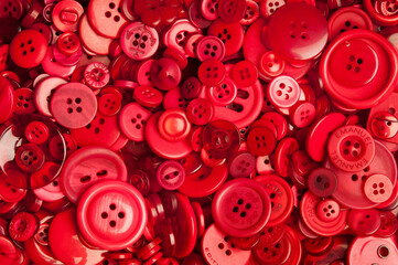 background pattern of red buttons of various size