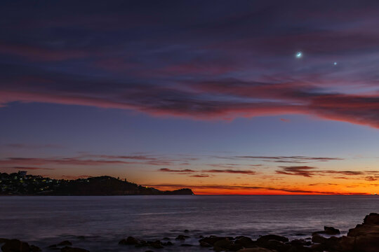 First Light Over The Ocean With 9 Percent Sliver Of Moon And Stars