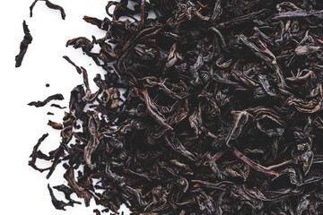 dried black tea on a white acrylic background