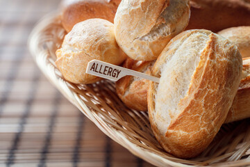 Allergy sign on white bread rolls, gluten intolerance and diet concept