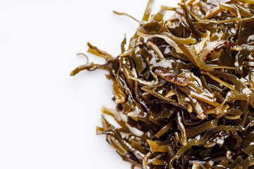 seaweed salad on a white acrylic background