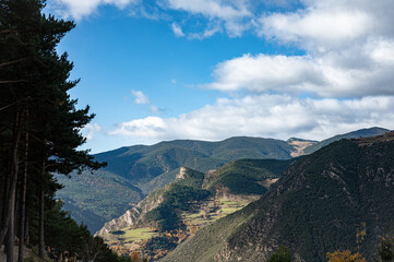 Nice landscape of mountain valley in autumn winter, blue sky with white clouds