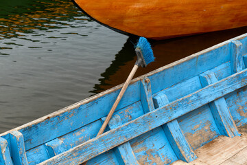 blue broom on a Boats in the fishing harbor of Torreira, near Aveiro, Portugal