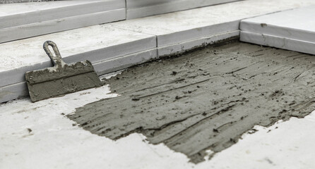 Waterproofing mortar on a concrete floor. Concrete floor repair. Leveling concrete pavement for mix...