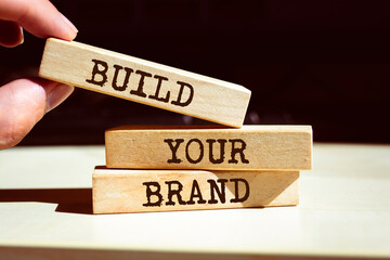Wooden blocks with words 'BUILD YOUR BRAND'.