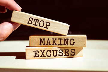 Wooden blocks with words 'Stop making excuses'.