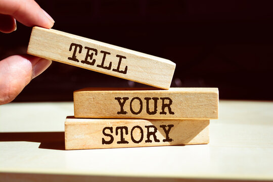 Wooden blocks with words 'Tell Your Story'.