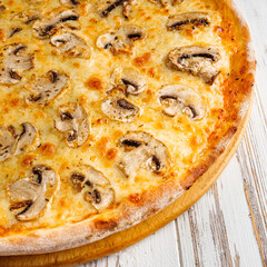 delicious hot traditional italian pizza on a white wooden rustic background