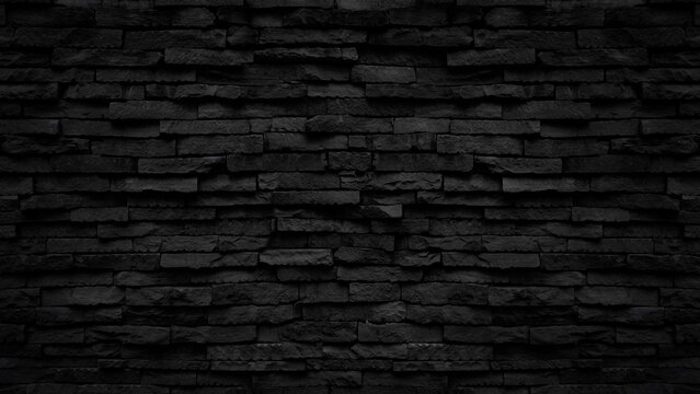 Old black stone brick wall texture for background or tiles floor decorative design.