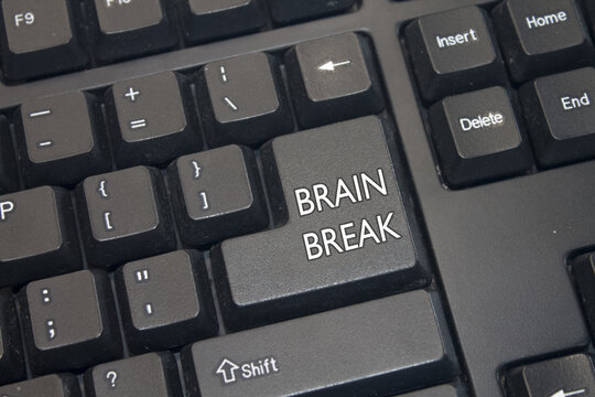 Black Computer Keyboard with Brain Break text. Close-up of an electronic Computer Device part, keypad.