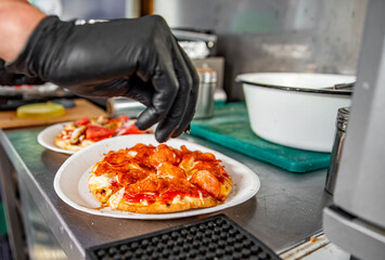 hand of chef baker making mini pizza at kitchen. The process of making pita pizza. cooking italian pizza
