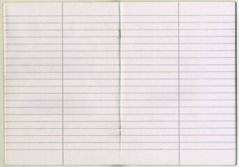 High resolution quality scan of school stapled notebook opening with line paper with vertical line...