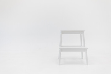 white chair on white wall