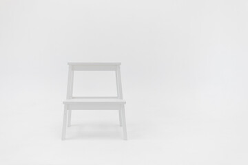 white chair on white wall