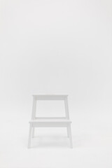 white chair on white wall