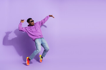 Full length profile photo of overjoyed carefree person stand tip toe dancing isolated on purple color background - Powered by Adobe