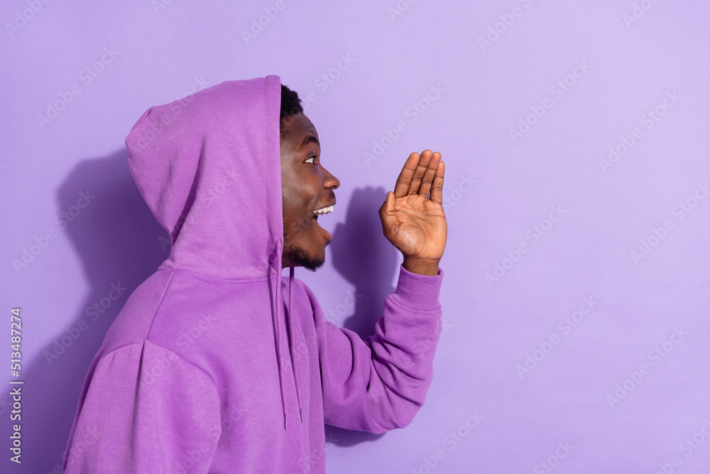 Wall mural profile side view portrait of attractive cheerful amazed guy saying copy space isolated over bright 