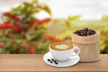 Hot coffee cup with coffee beans on the wooden table and the plantations background