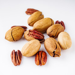 delicious fresh pecans on a white acrylic background