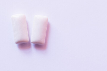 Close up view of chewing gums on white background.
