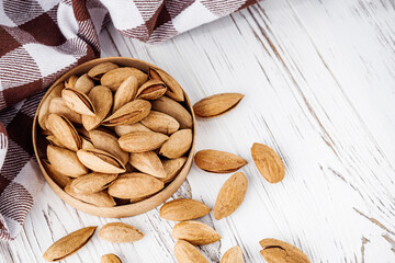 fresh almonds in shell on a white background