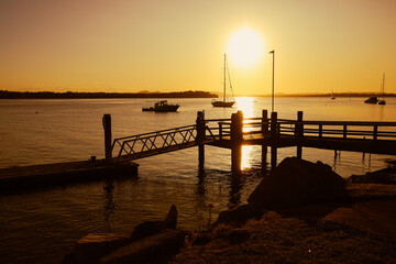 Vibrant afternoon sunset over jetty at Iluka, NSW Australia