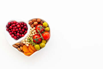 Healthy food in heart shaped dish. Healthy lifestyle and nutrition eating concept