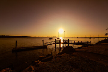 Fototapeta na wymiar Vibrant afternoon sunset over jetty at Iluka, NSW Australia