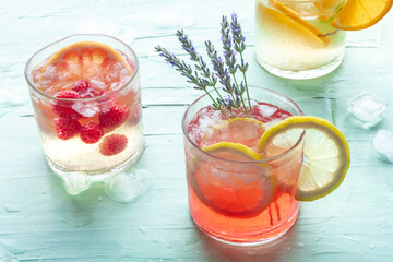 Summer cocktails or mocktails, cold drinks with citrus fruits and lavender, party lemonade with ice