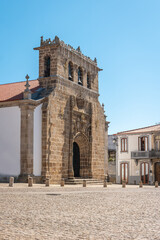 Fototapeta na wymiar Facade of the sixteenth century Gothic Manueline church with a three bells belfry, in the town of Vila Nova de Foz Coa, Portugal