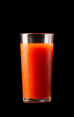 Tomato or carrot juice in a tall glass glass on a white background.