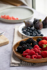 preparing a breakfast with red fruits