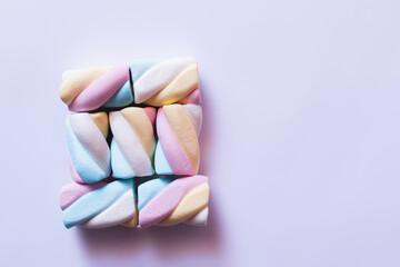 Flat lay with marshmallows on white surface.