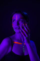 Young Woman Under Neon Light..