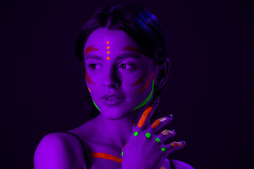 Portrait of Beautiful Fashion Woman in Neon UF Light.