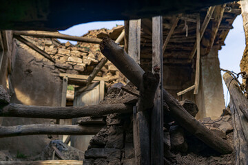 ruins of a destroyed traditional peasant house