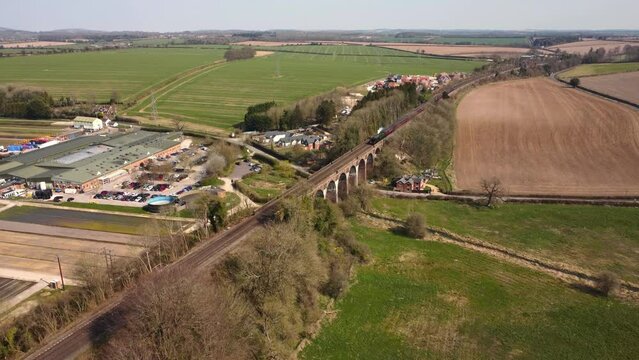 The Flying Scotsman, 4k Aerial video. Crossing a viaduct in Hampshire. With train audio including original train whistle